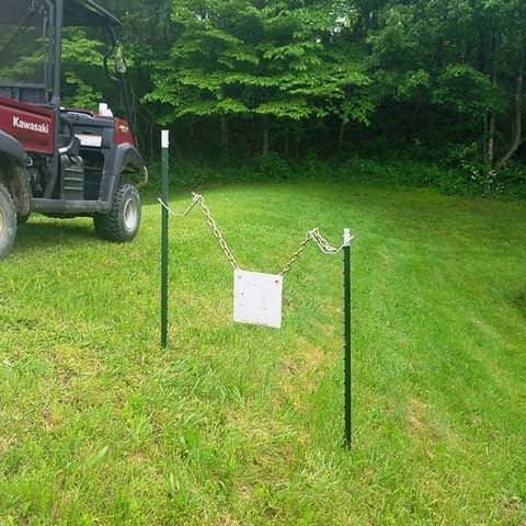 Hang Fast T Post target hanger with two t posts and 2 chains hanging a target with two mounting holes