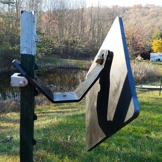 Hang Fast Fail Safe T Post target hanger with 10 inch diamond AR500 target plate mounted on a T Post.